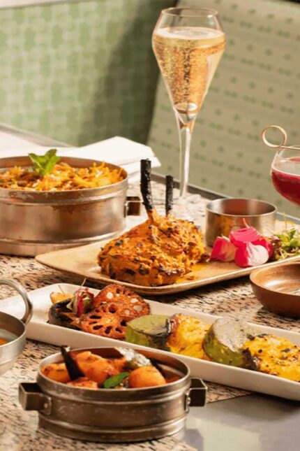 Festive Indian Diwali feast featuring small plates and main curries at Bombay Bustle Mayfair.
