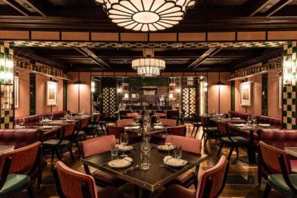 Interior view of Bombay Bustle's modern, Indian railway-inspired dining space in Mayfair, London.