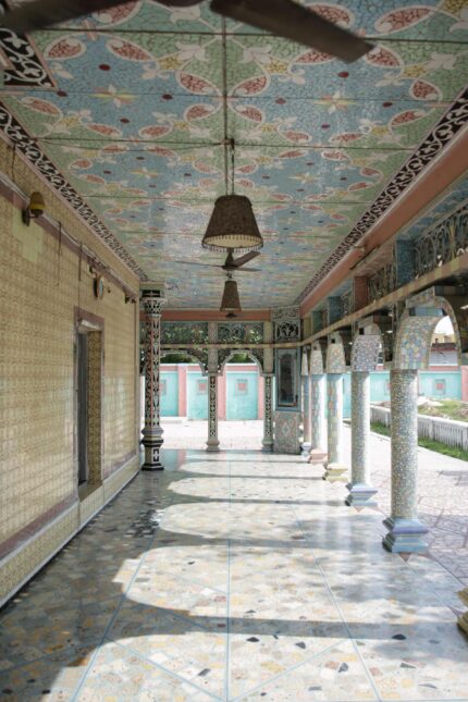 Traditional Indian building with mosaic pillars in Rampur inspiring the Bombay Bustle menu.