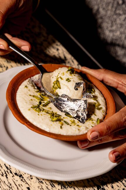 Sweet Phirni rice pudding spiced with green cardamom at Bombay Bustle on Maddox Street.